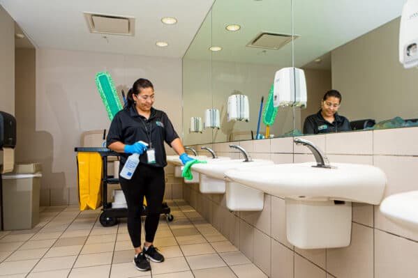 Sanitizing a fitness center locker room and restroom in Austin