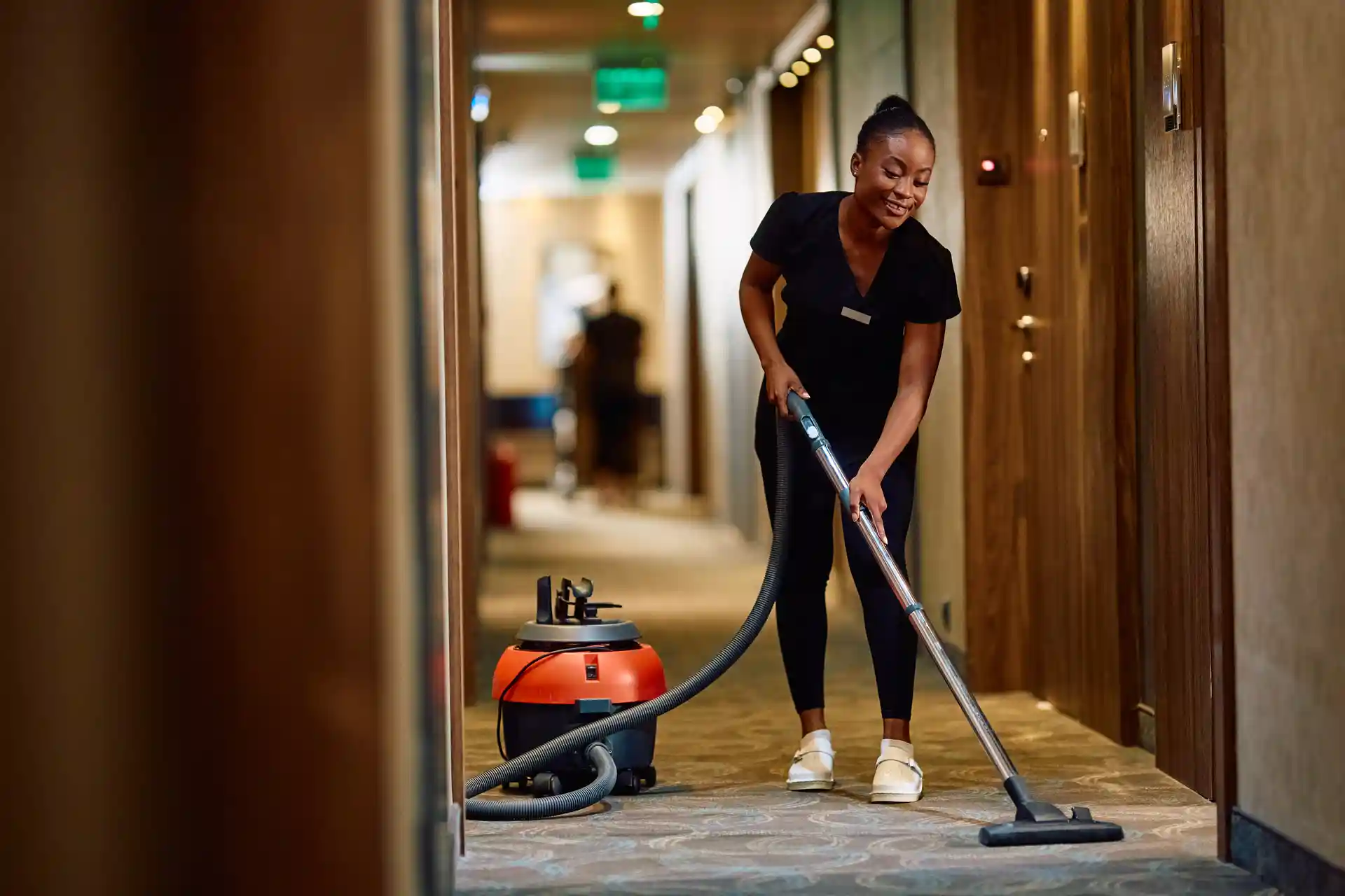 Professional hotel cleaning crew servicing a guest room in Austin