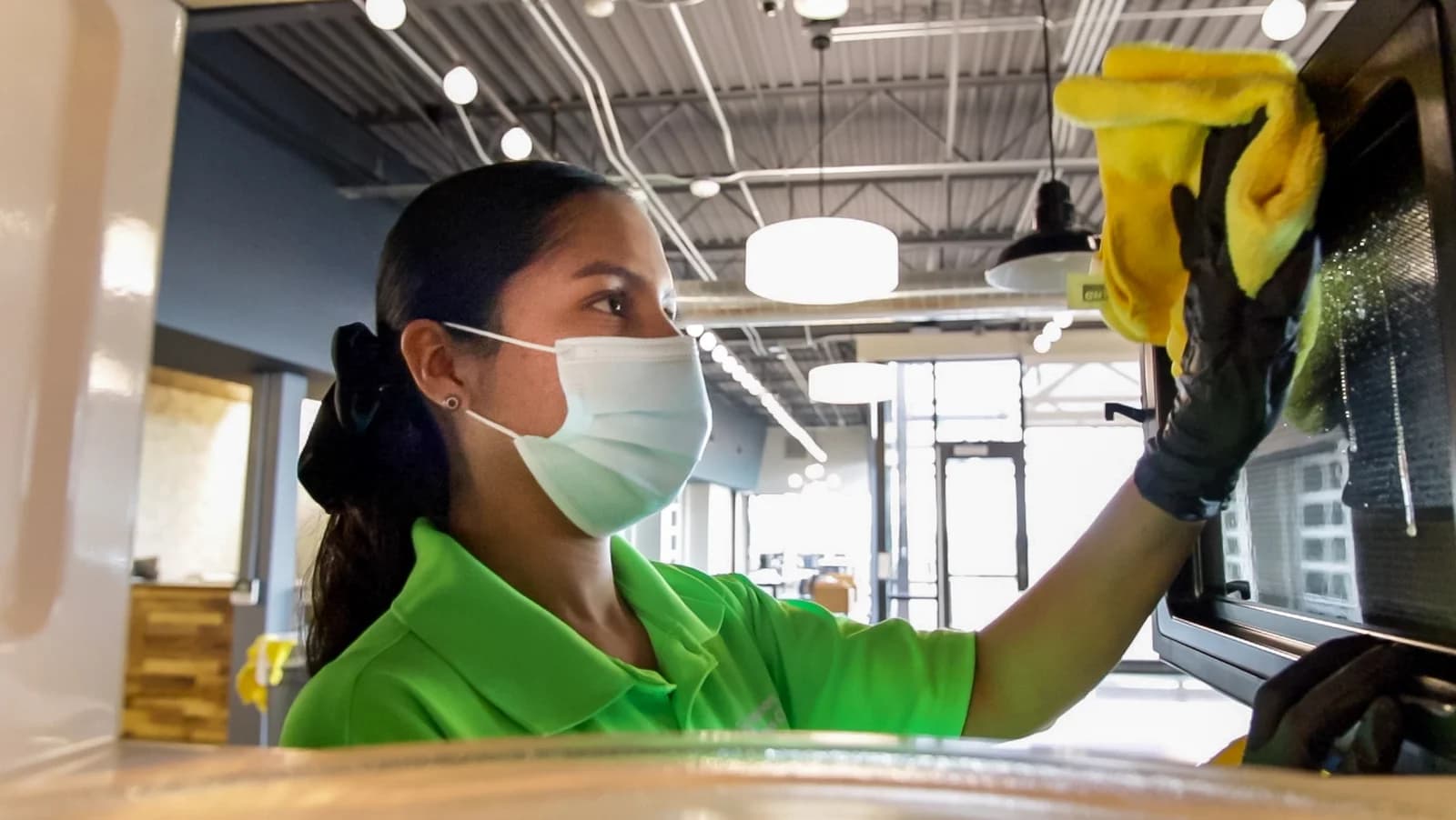 Commercial cleaner performing detailed deep cleaning in an Austin facility