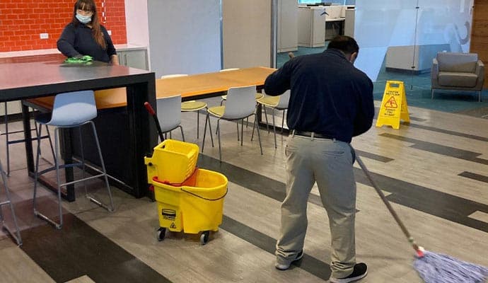 Cleaning a school common area and cafeteria in Austin