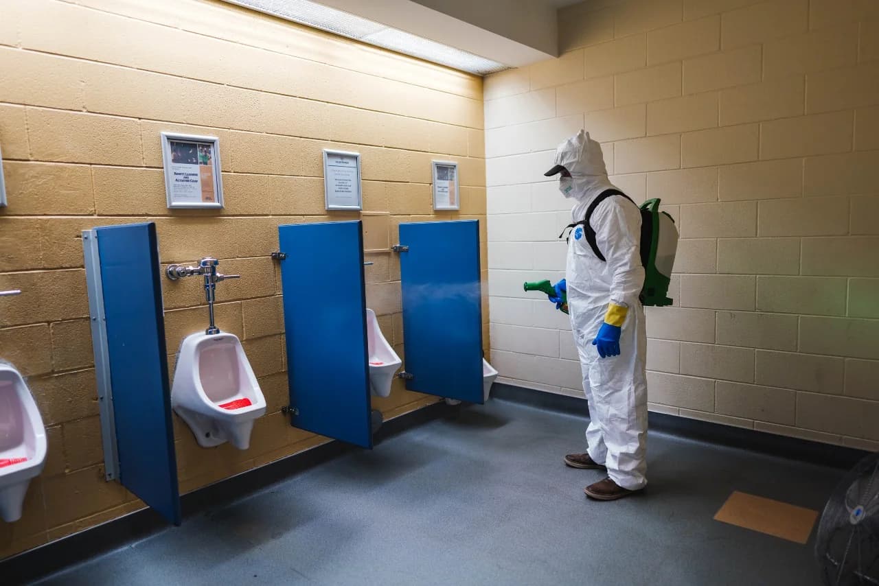 Sanitizing a fitness center locker room and restroom in Austin